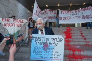 BREAKING: Activists Cover Israeli Consulate Steps in Toronto with River of "Blood"