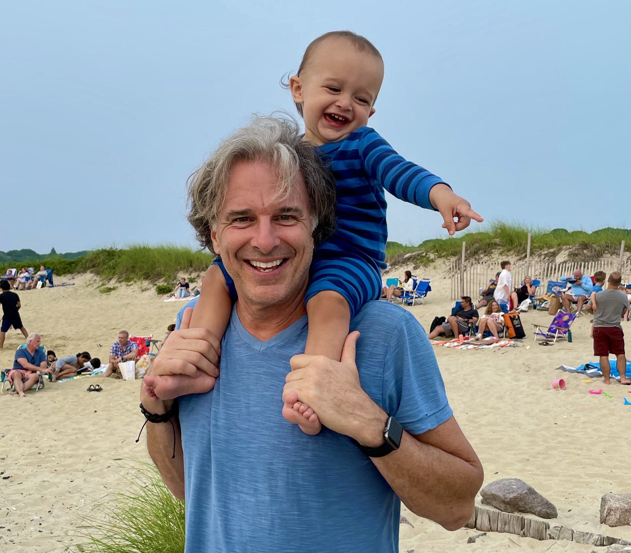 John Miksad on the beach with 15 month old grandson Oliver