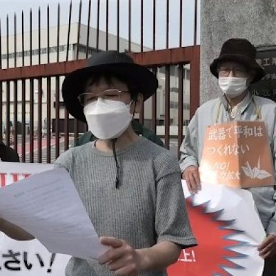 A protester reading our petition in Japanese