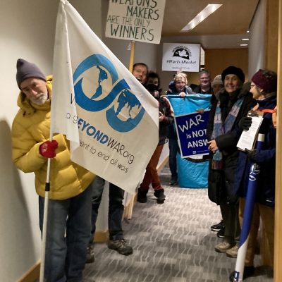 Members of the Madison chapter hold anti-war signs